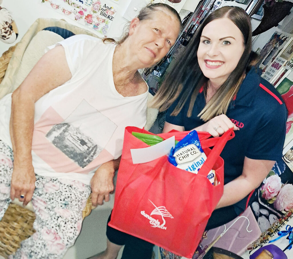 Melinda sharing a Hamper of Hope with Maxine, a Yarrabilba resident